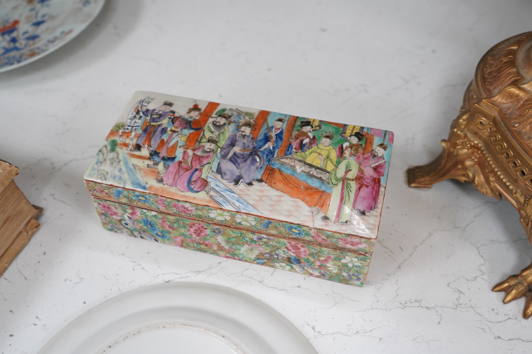A Chinese famille rose pen box, and a similar plate, c.1830, 19.5cm wide